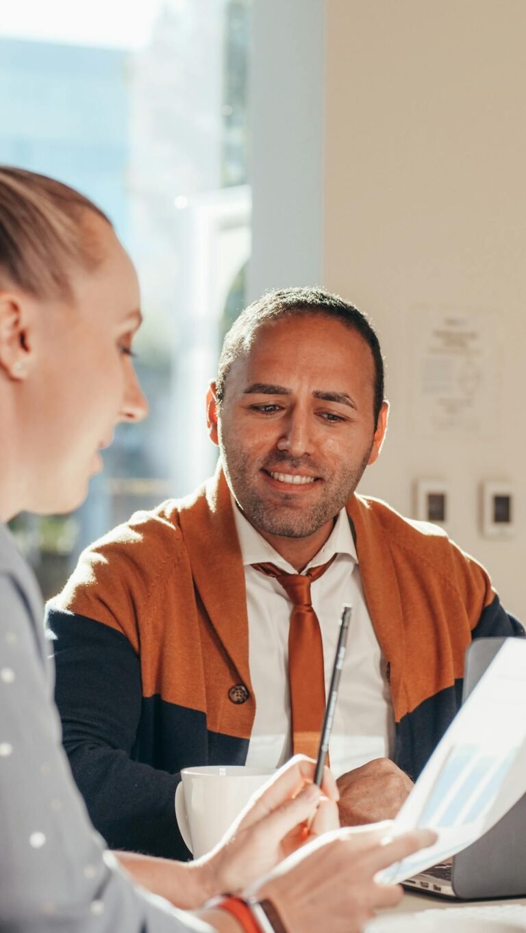 Man in Orange Button Up Shirt Smiling